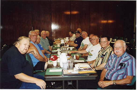 057.jpg.jpg - A group of C&NW veterans get together for breakfast on the second Tuesday of each month at Myers Restaurant and Bar, 4260 S. 76th St., Greenfield, WI, 414-321-4400.  Here’s who was there on July 11, 2006.  (On the left, front to back) Captain Wally Lindemann, Jim Barlow, Bob Stewart, Jim Yanke, John Gavin, Earl Schmidt, & Maynard Garland.  (On the right, same way) George Bink, Jr., Roger Bergholz, Rod Ewert, Jake Kaiser, Richard Yagodinski, William Zimbauer, Dan Sylvester & Marv Garland.
