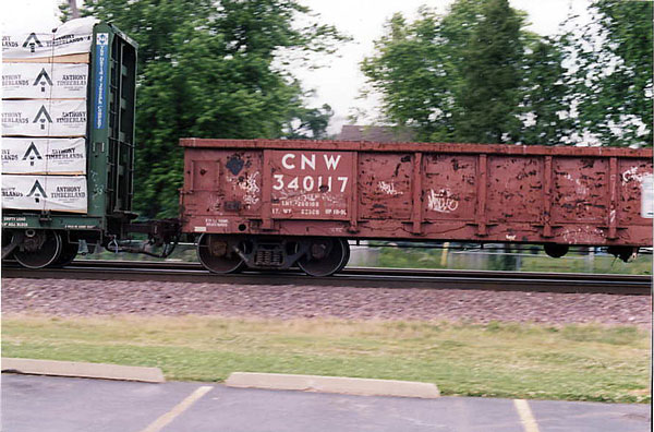 154.jpg - Rochelle, IL - another C&NW gondola westbound to North Platte, July 2009.