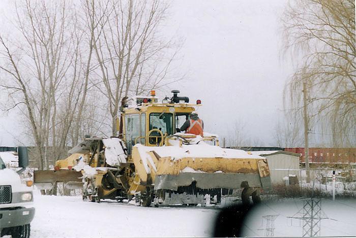 170.jpg - A track machinery car sits at Bain Station Road.  It was there to assist in cleaning up the February 2010 derailment between Bain & Highway 50.